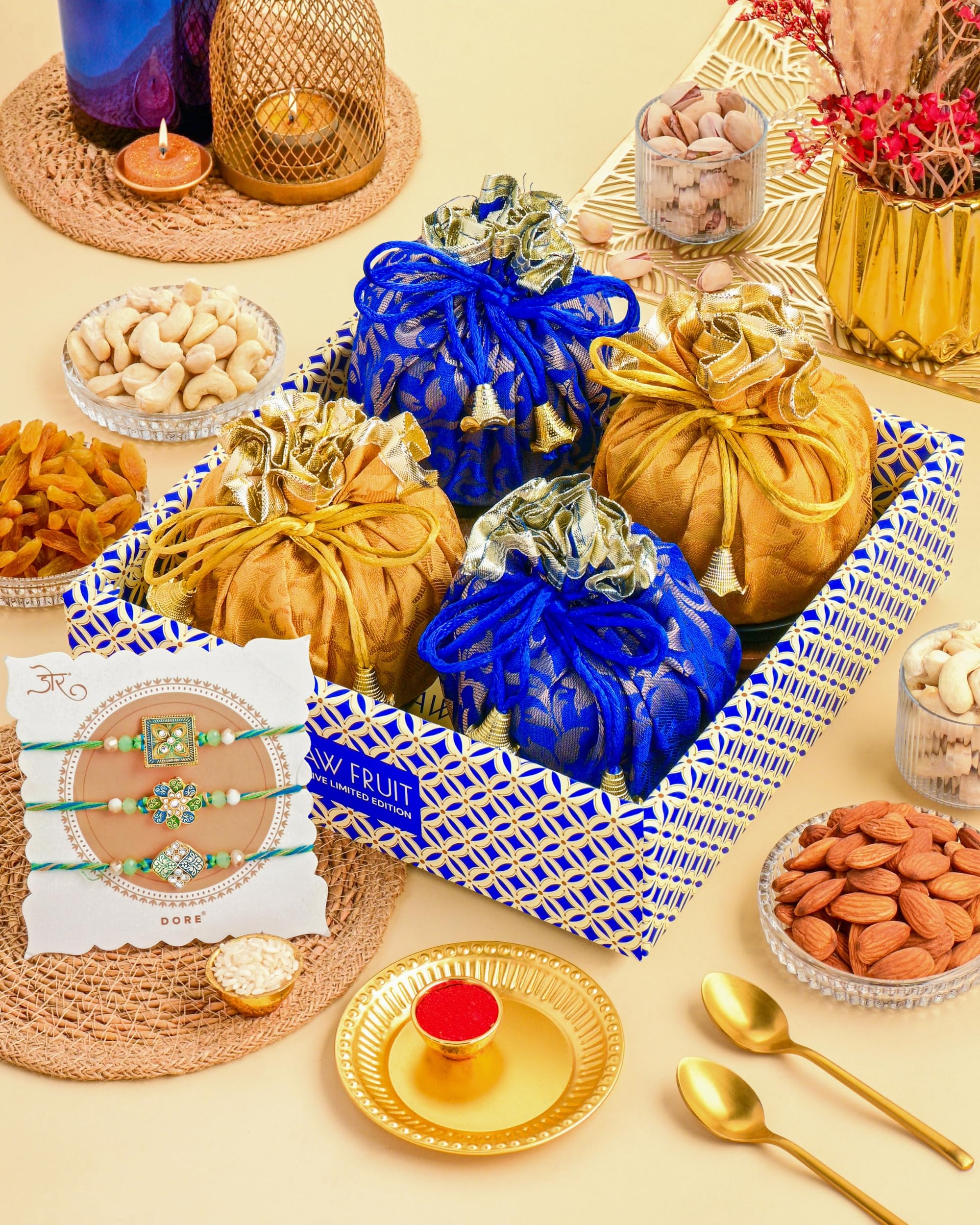 Hyperfoods® Rakhi for Brother with Dry Fruits Rawfruit's Handcrafted Potli Blue And Red with Thali Roli & Chawal Rakhi Gift Hamper for Brother Pack of 4 Cashew Almond Pistachios Raisins 495gm With Set of 3 Meena Rakhi