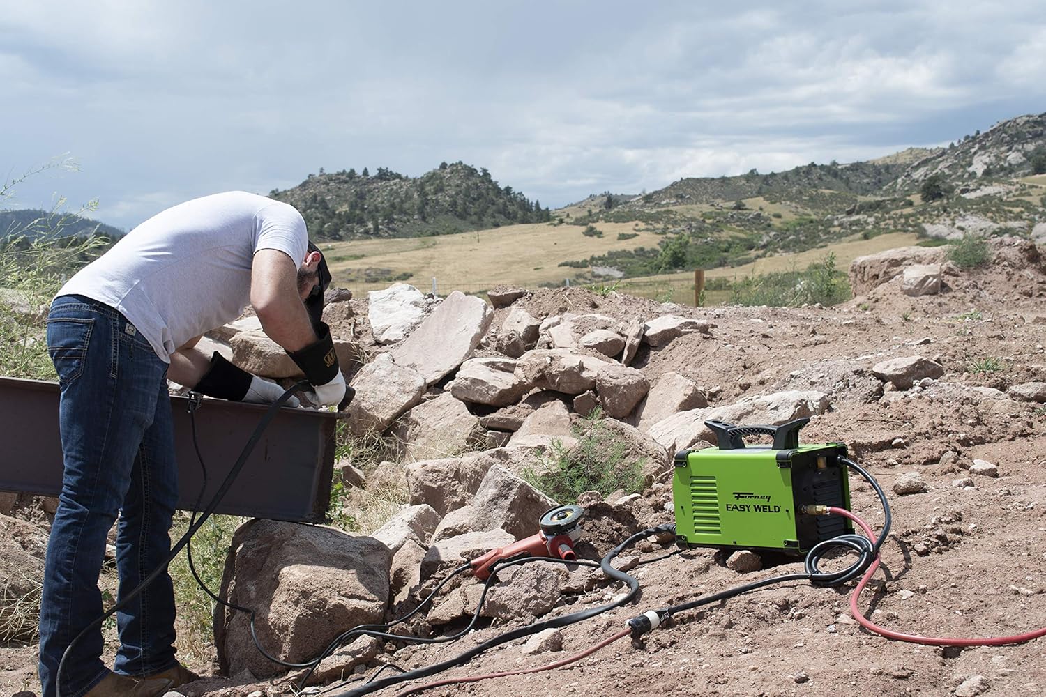 Plasma cutter in use outdoors, cutting a metal beam