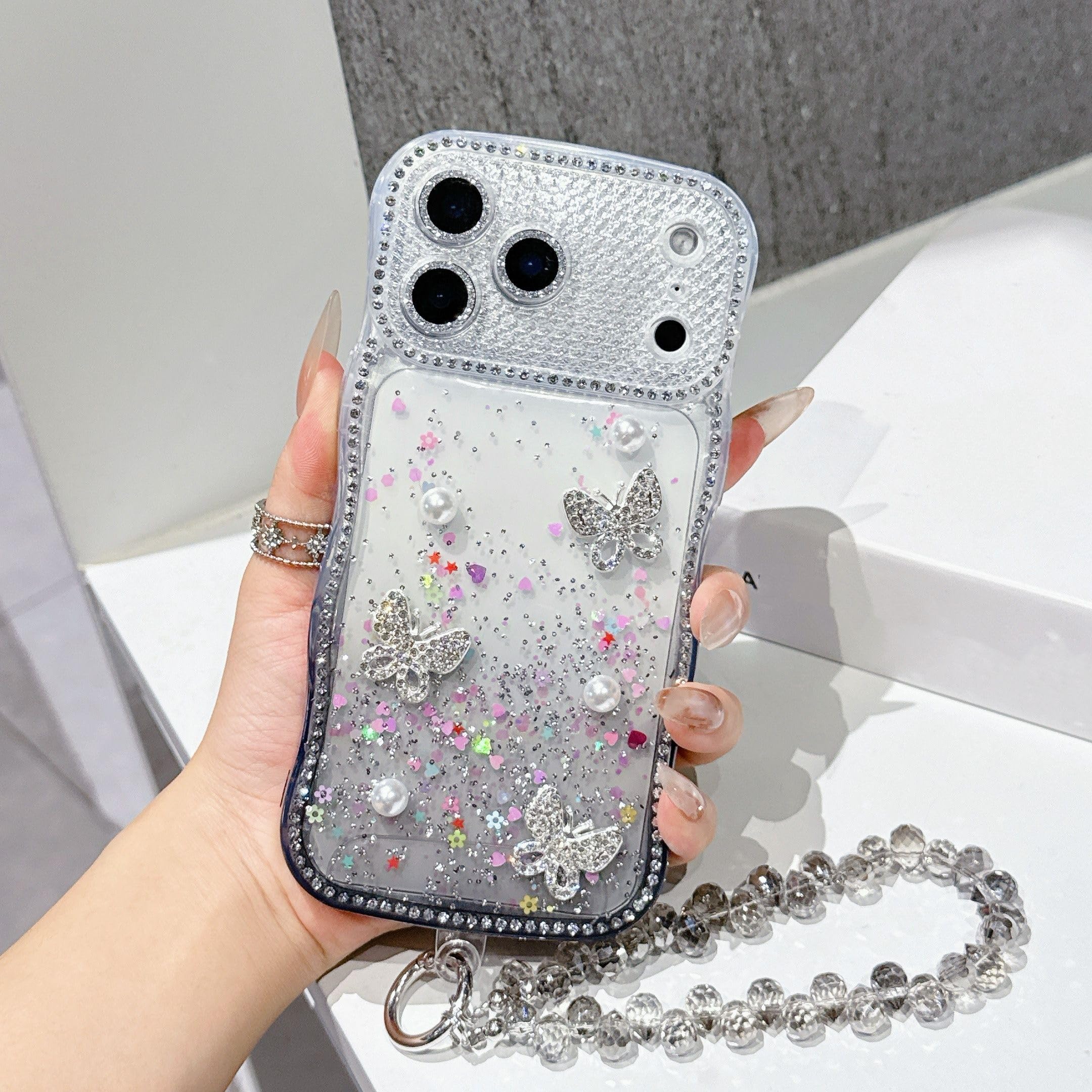 Coque iPhone 17 Pro antichoc avec dragonne miroir cœur paillettes