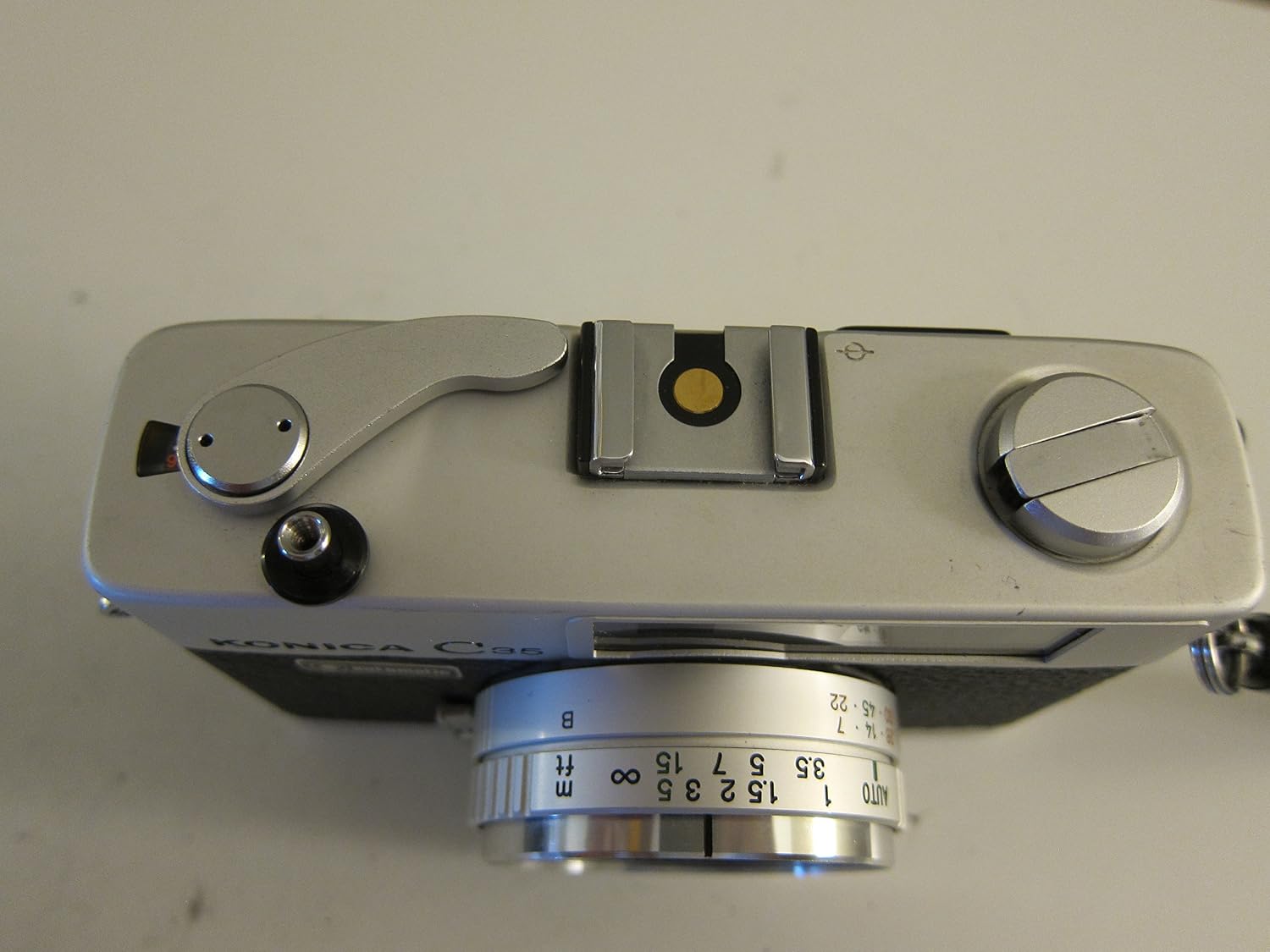 Bottom view of Konica C35 camera with battery compartment and tripod socket