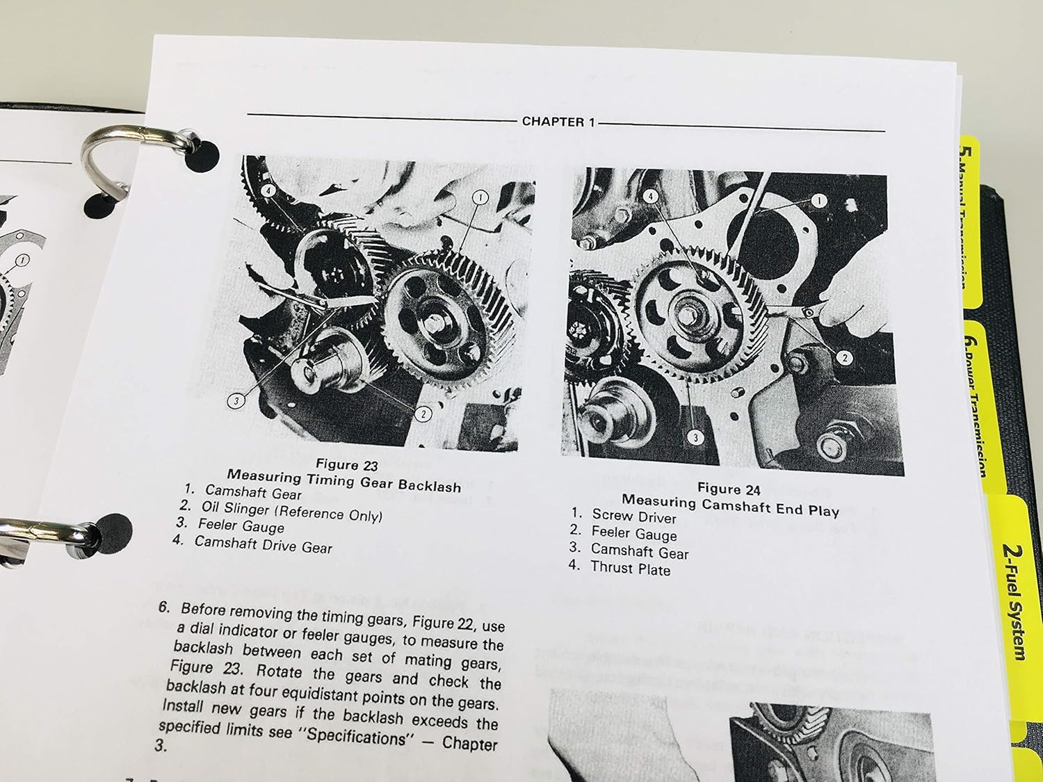 Close-up of manual page showing figures for measuring timing gear backlash and camshaft end play