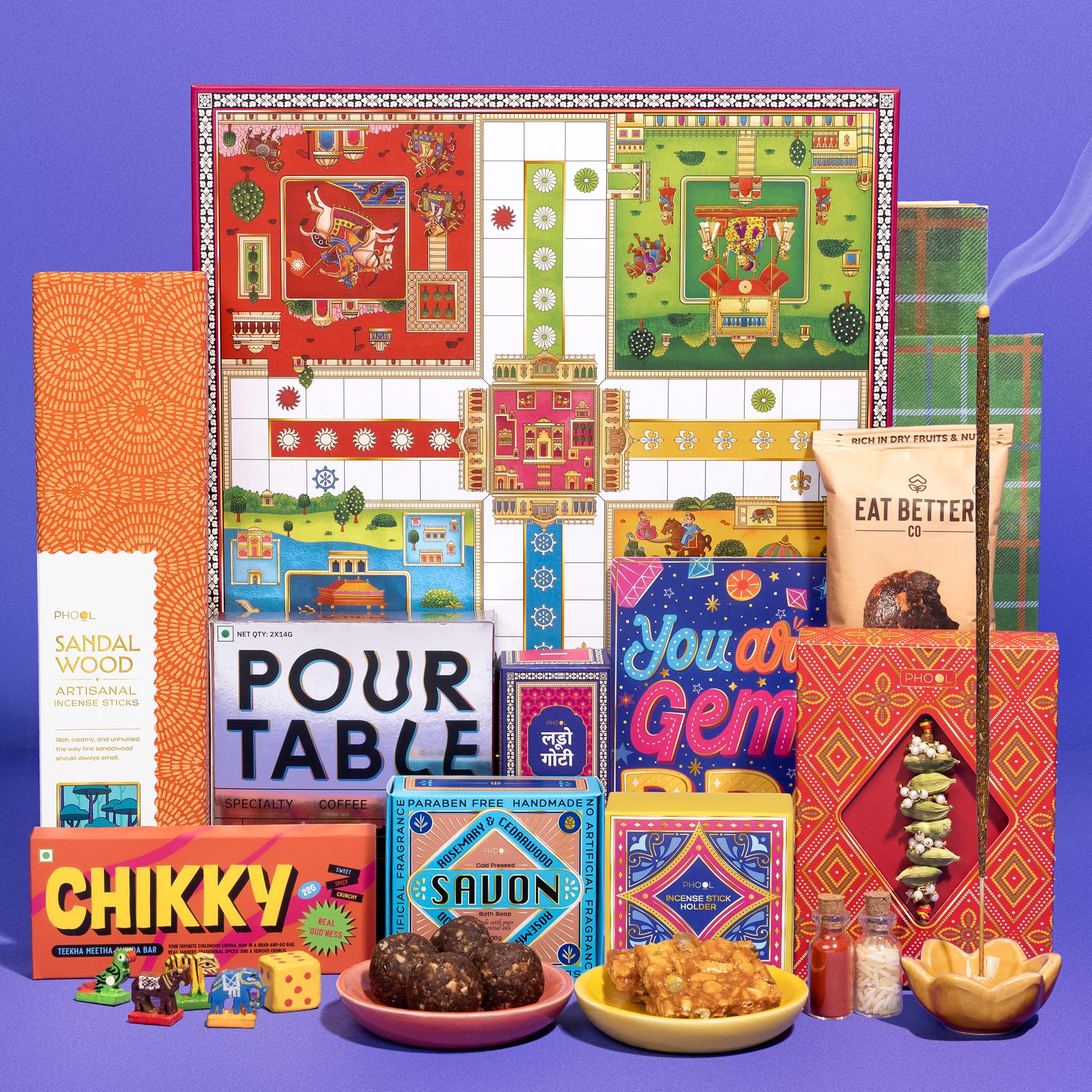 Phool 11 Item Ludo Rakhi Gift Box for Brother | Elaichi Rakhi, Sandalwood Incense, Coffee, Laddoo, Chikki, Handmade Soap, Pocket Square & Ludo Game | Premium Raksha Bandhan Gift Hamper-image-10