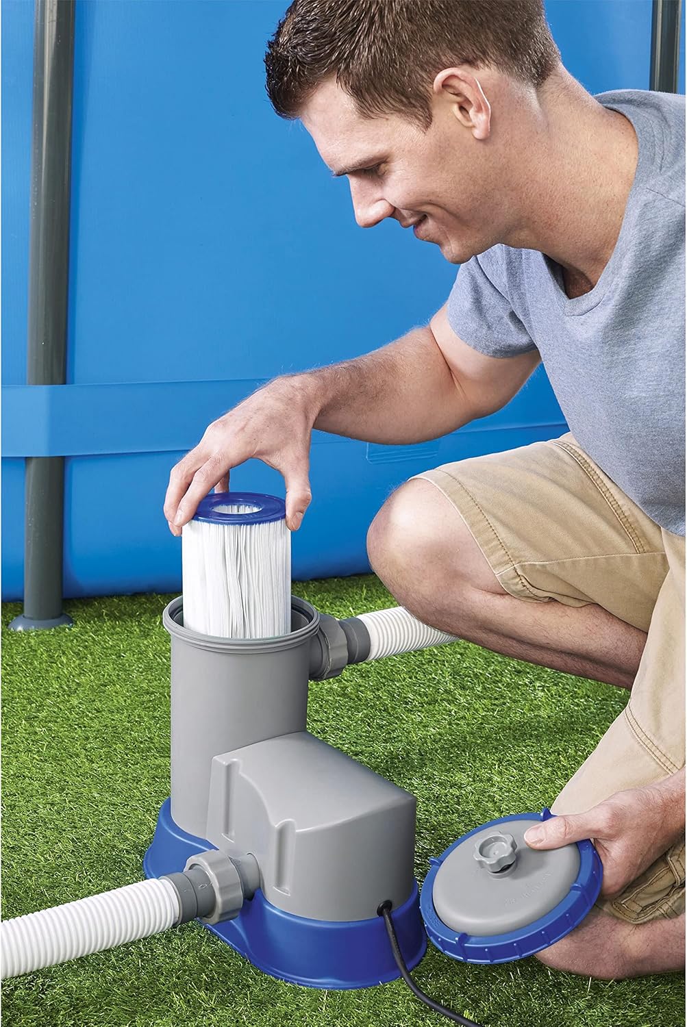 Man replacing filter cartridge in Bestway Flowclear pump