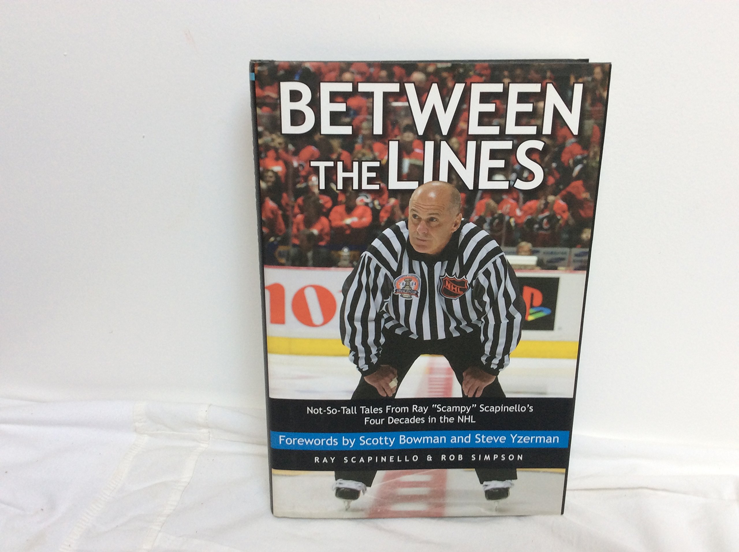 Buy Between the Lines: Not-so-tall Tales from Ray "Scampy" Scapinello's Four Decades in the NHL — BookShops.in