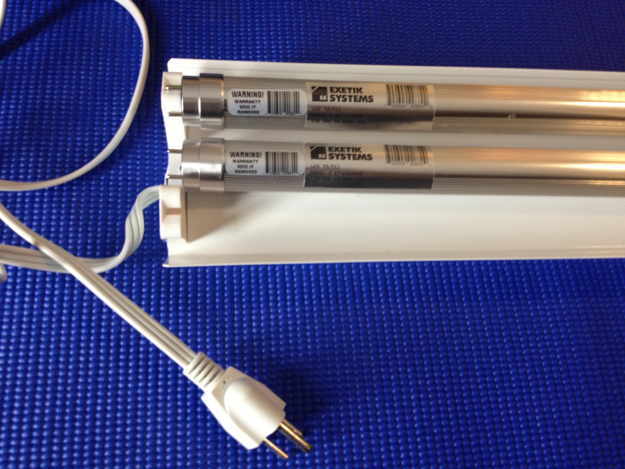 White plug-in LED Light Fixture with 2x 4ft Energy Efficient LED tubes. Perfect for garage, workbench, warehouse etc.