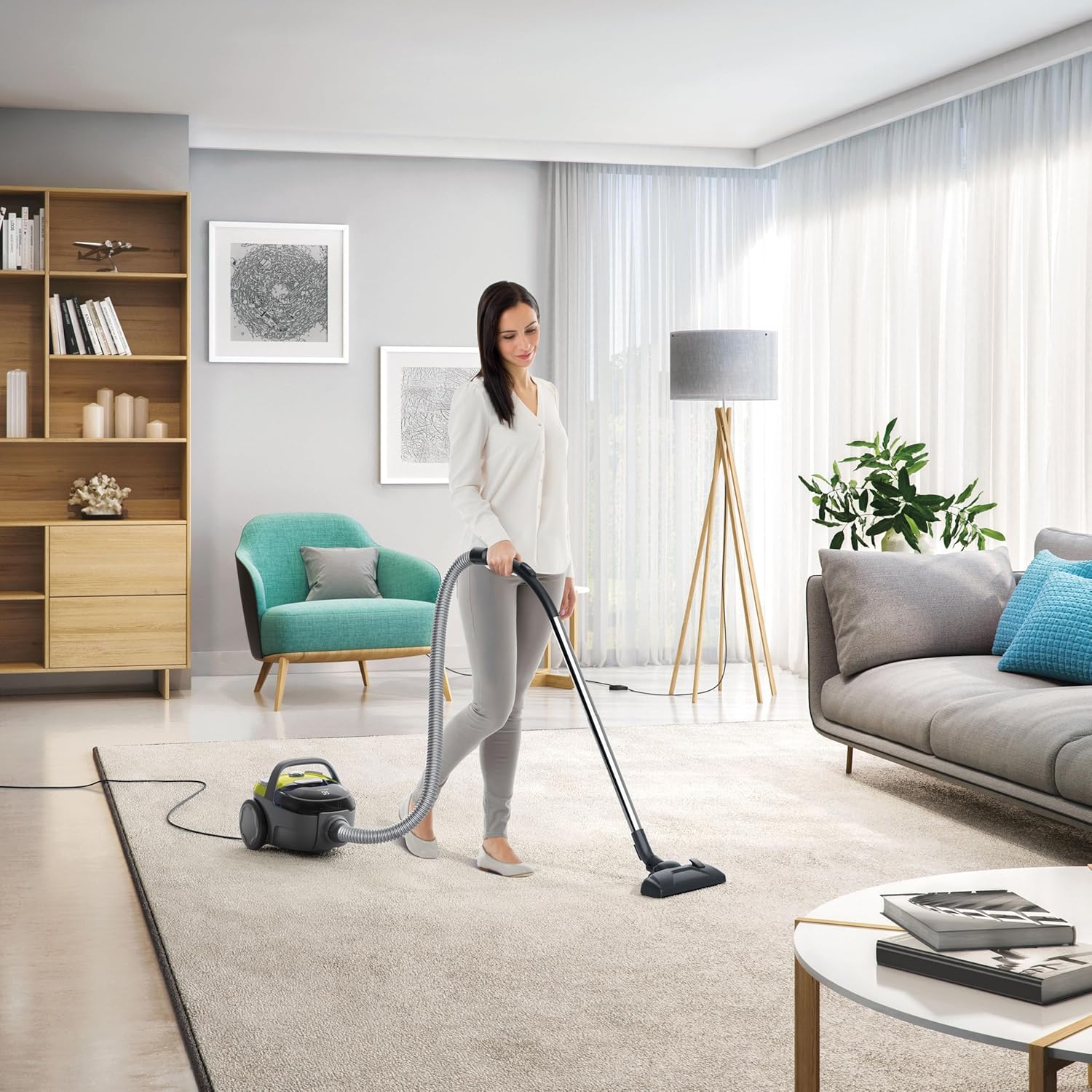 Woman using Electrolux CompactGo Z1231 Vacuum Cleaner