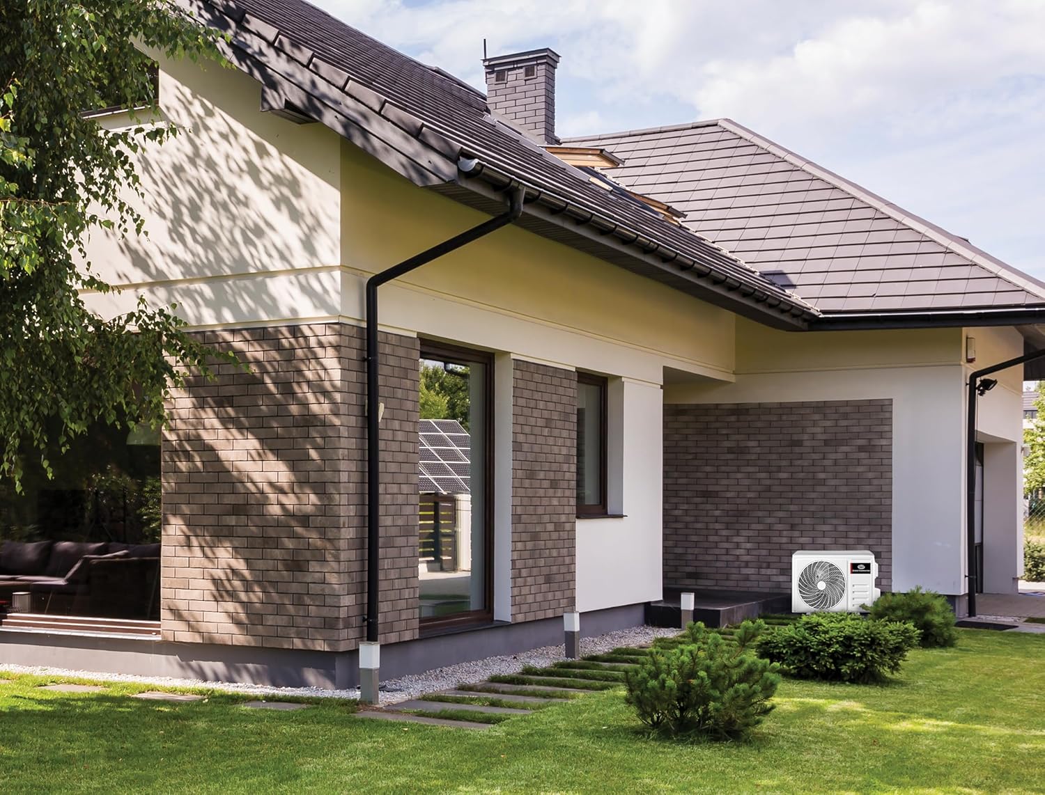 Outdoor unit installed next to a house