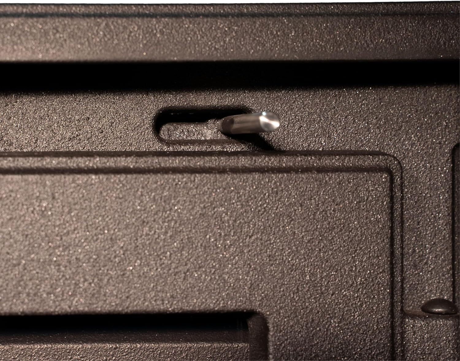 Close-up of the primary air control lever on the EIDER BIOMASA IRIS wood stove