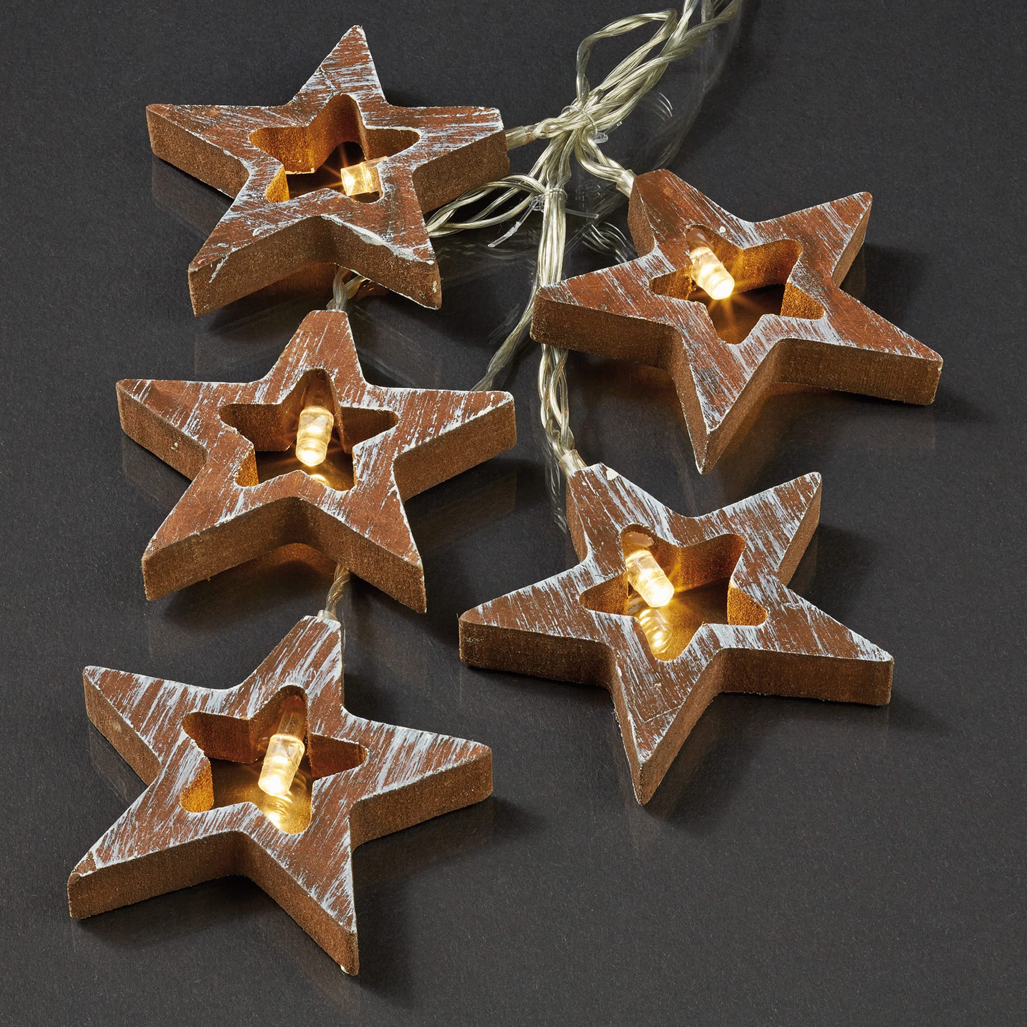hellum LED Lichterkette Batterie Holzsterne (3xAAA), 10 LED warmweiß innen | Lichterkette innen klein mit Sternen aus Holz, beleuchtet 1,35m, Kabel transparent, für und Weihnachtsbaum und Fenster 521108