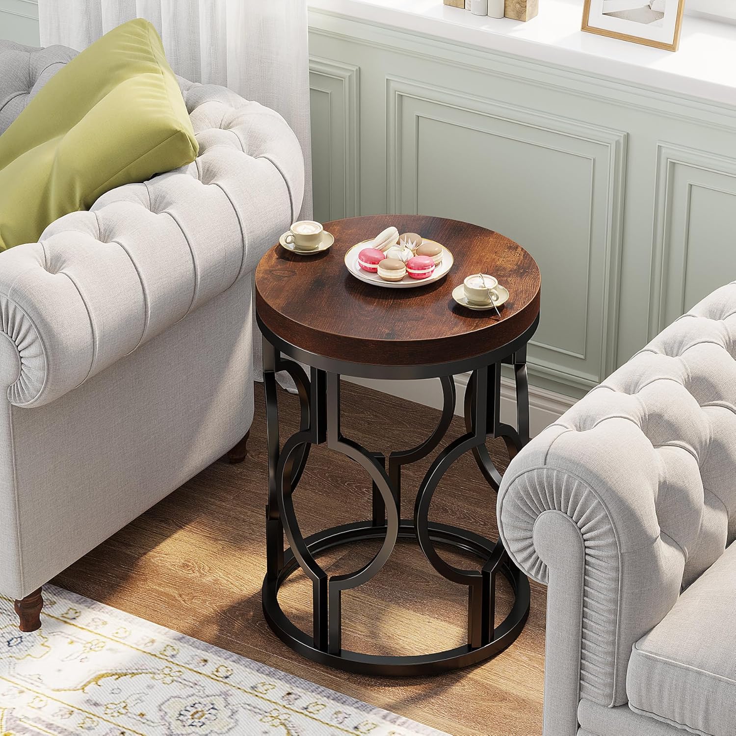 Tribesigns Round End Table placed next to a sofa in a living room setting, holding beverages and snacks.