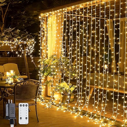 JMEXSUSS 300 LED Remote Control Christmas Curtain Lights, Plug in Fairy Curtain Lights Outdoor, Window Wall Hanging String Lights for Bedroom Backdrop Wedding Party Indoor Patio Xmas Decor, Warm White