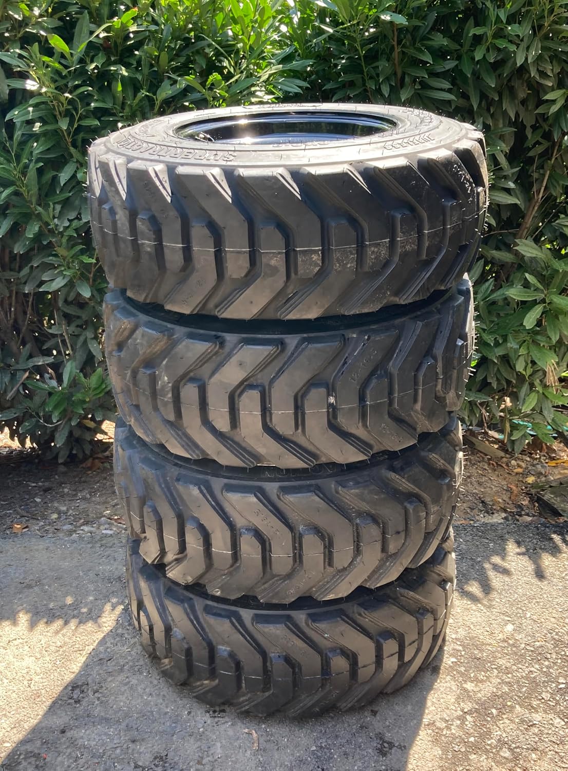Set of 4-HD FOAM FILLED (NO FLAT) 12-16.5 Forerunner SKS-8 Skid Steer Tires on Black Wheels/Rims (8 lug) for Bobcat & more (3.88" Back Spacing) -14PLY -12X16.5
