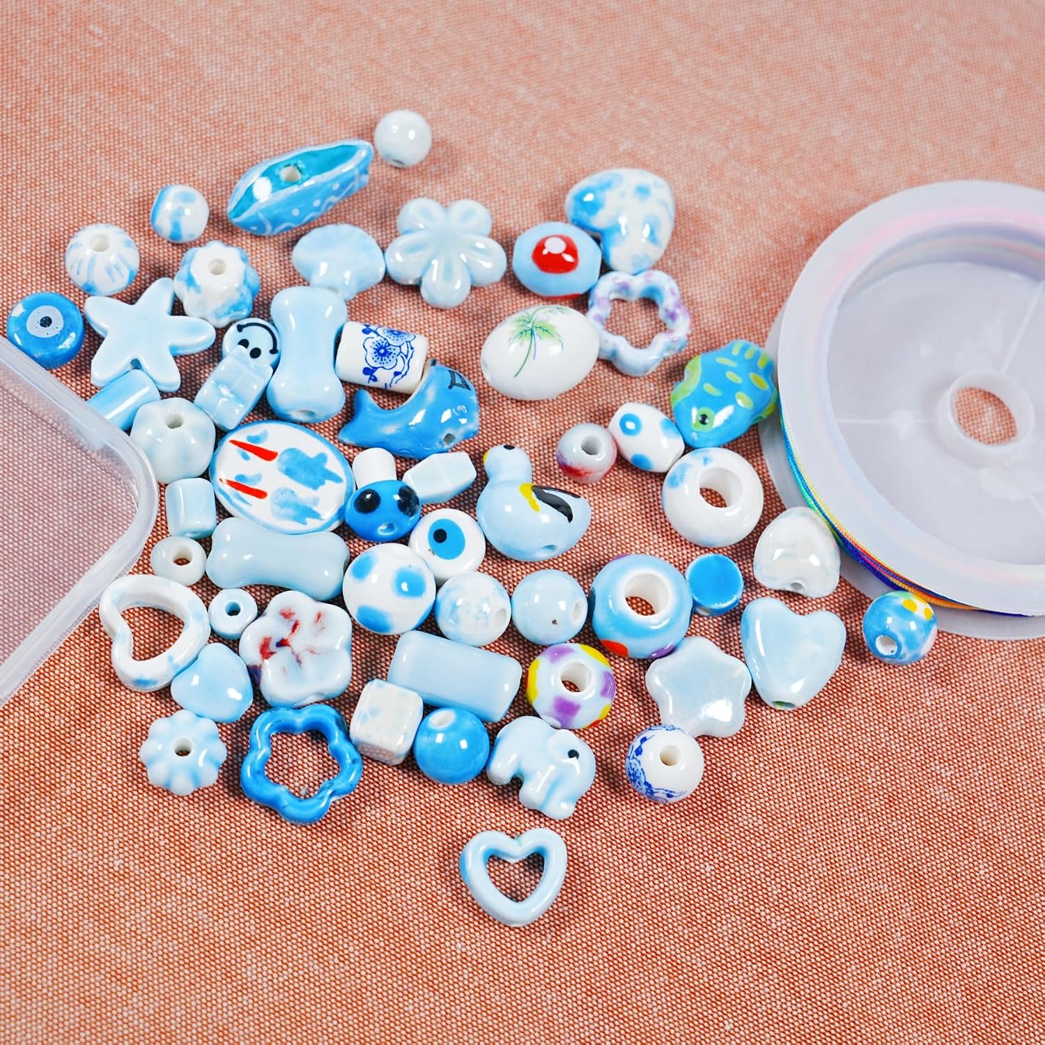 50Pcs Non-Repeated Ceramic Beads, 1 Box Blue Series Porcelain Beads with 1 Roll 10m Bracelet String, Flower Animal Shaped Porcelain Spacer Bead for Jewelry Making DIY Necklace Bracelet (Blue Series)