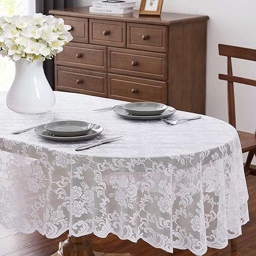 Mantel de encaje ovalado blanco de 60 x 84 pulgadas. El patrón floral clásico y elegante es la elección ideal para cualquier comedor de lujo,