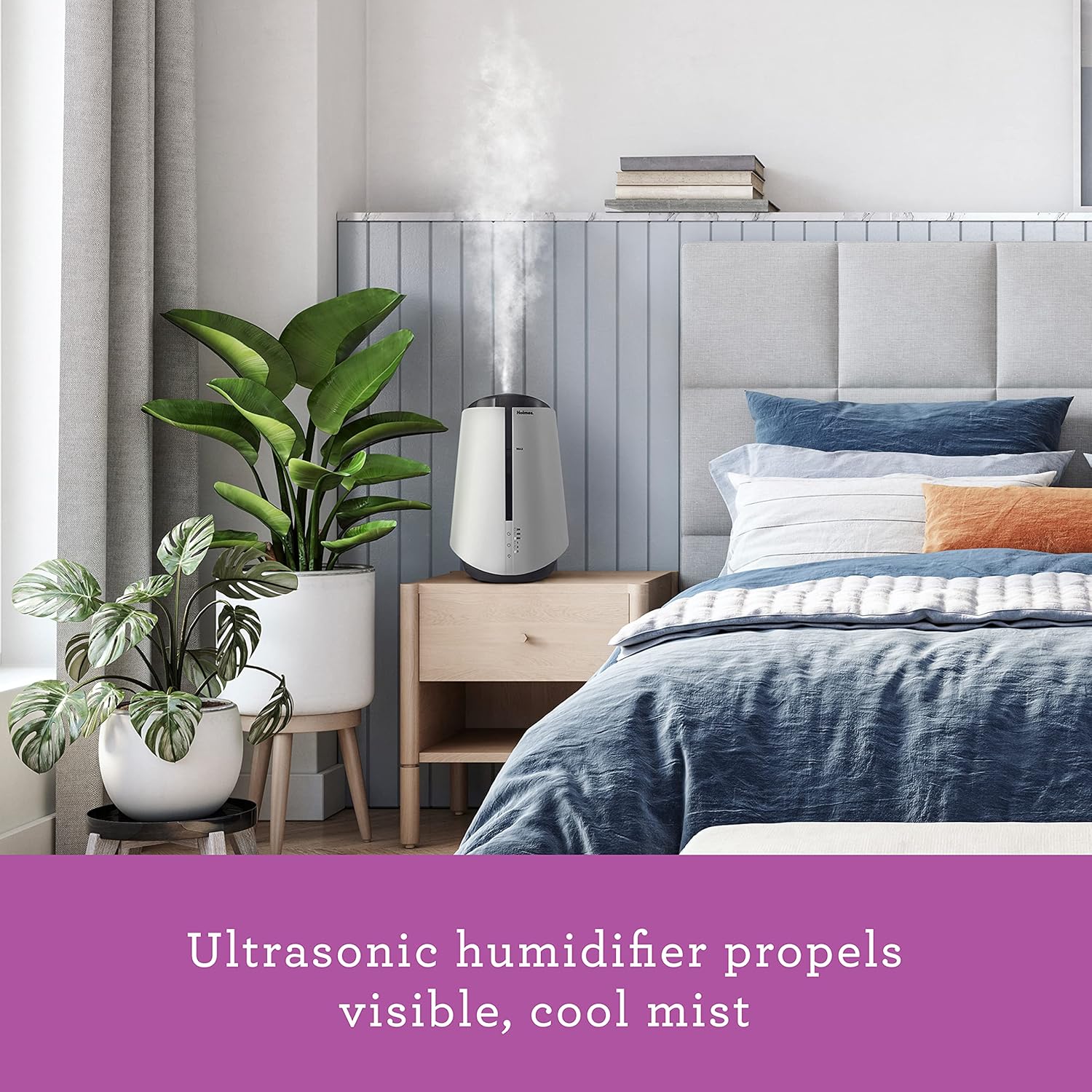 Humidifier in a bedroom setting, emitting cool mist