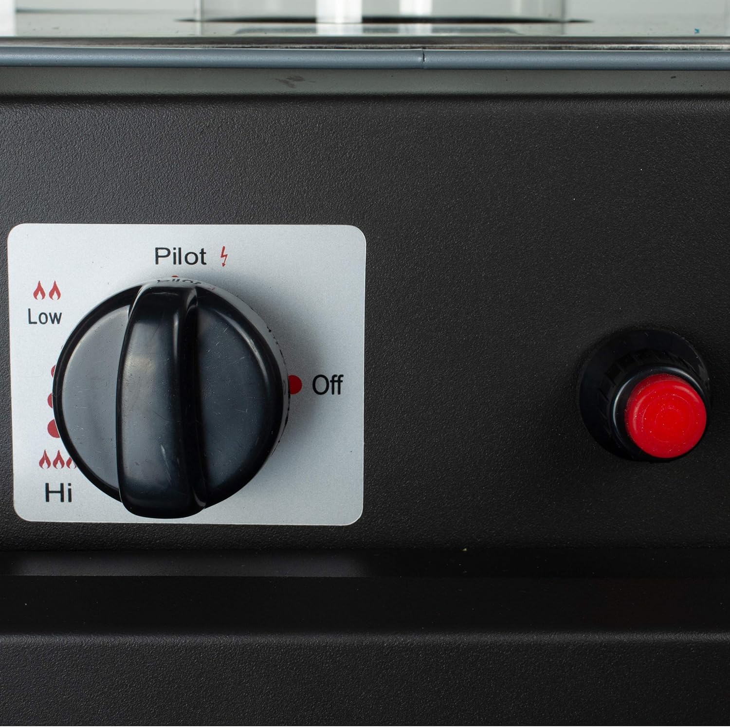 Close-up of the control knob and red igniter button on the Maltec Gas Patio Heater.