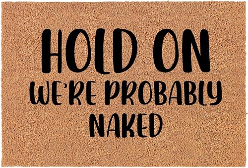 Felpudo de bienvenida con diseño de coco y fibra de coco para puerta, con texto en inglés "We're Probably Naked Funny (24 x 16")
