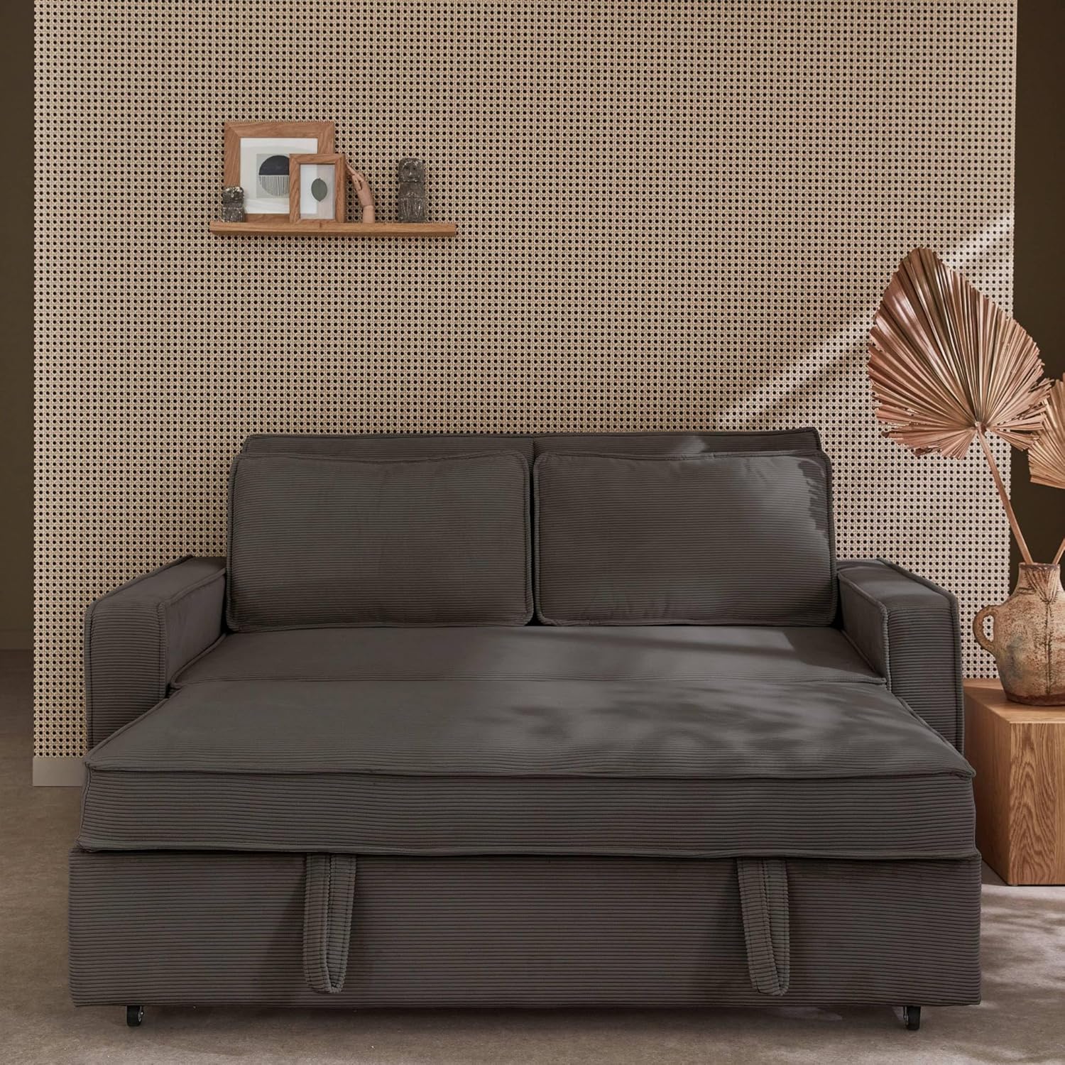 Sofa partially converted to bed, showing the pull-out mechanism