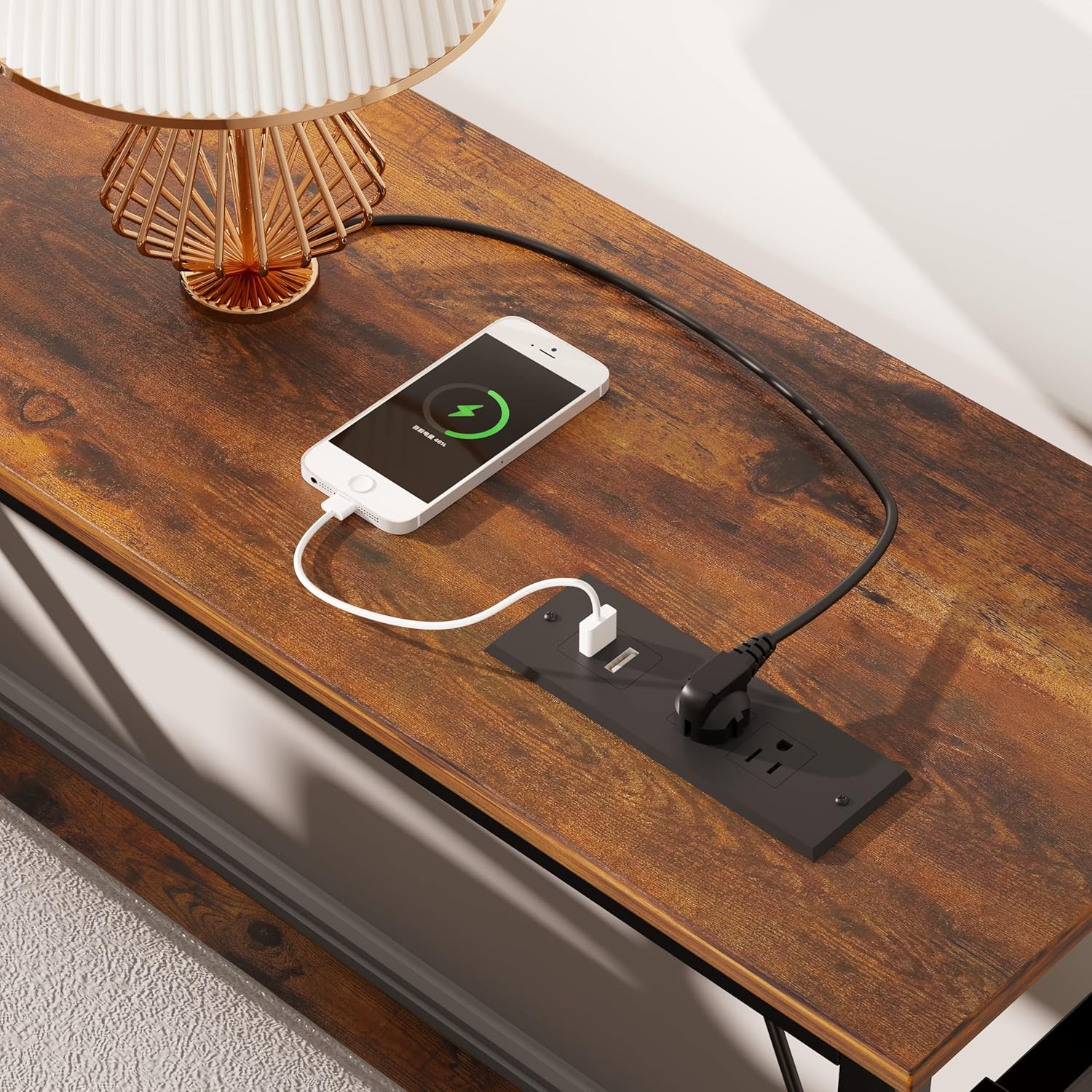Close-up of the integrated power strip with AC outlets and USB ports