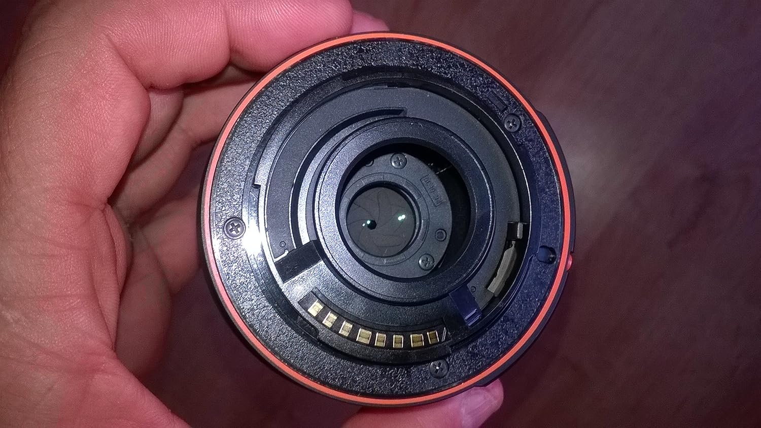 Front view of Sony SAL1855 lens showing the zoom ring, focus ring, and filter thread.