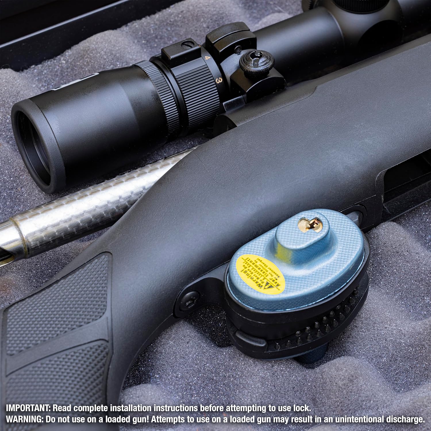 Master Lock trigger lock installed on a rifle