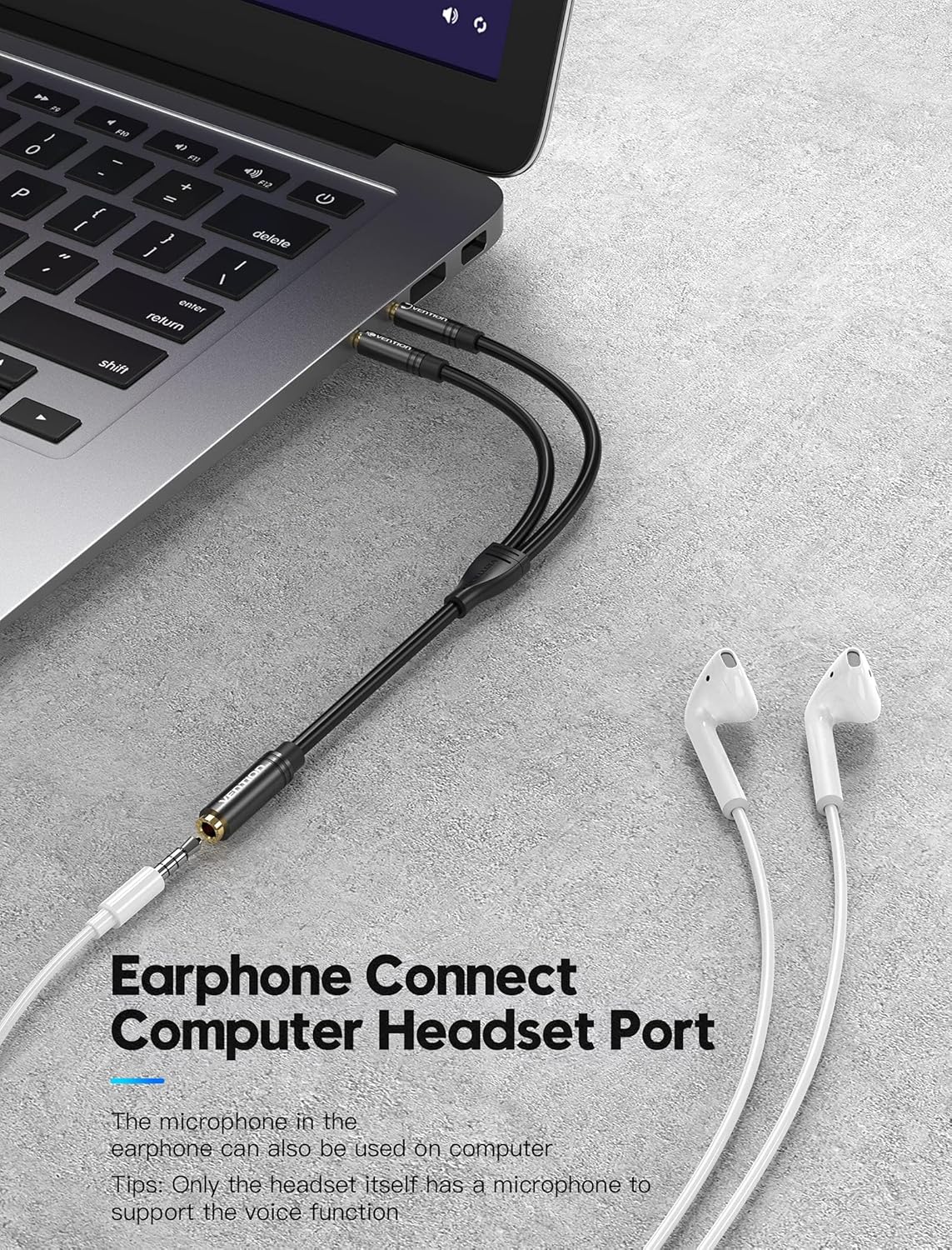 Person connecting earphones to a laptop via the VENTION audio splitter