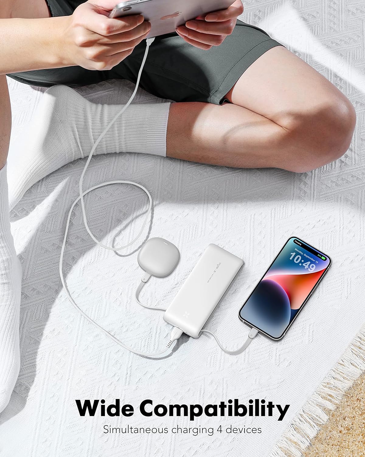 VIYISI Portable Charger G1158 simultaneously charging an iPhone, AirPods, and another device, demonstrating its multi-device charging capability.