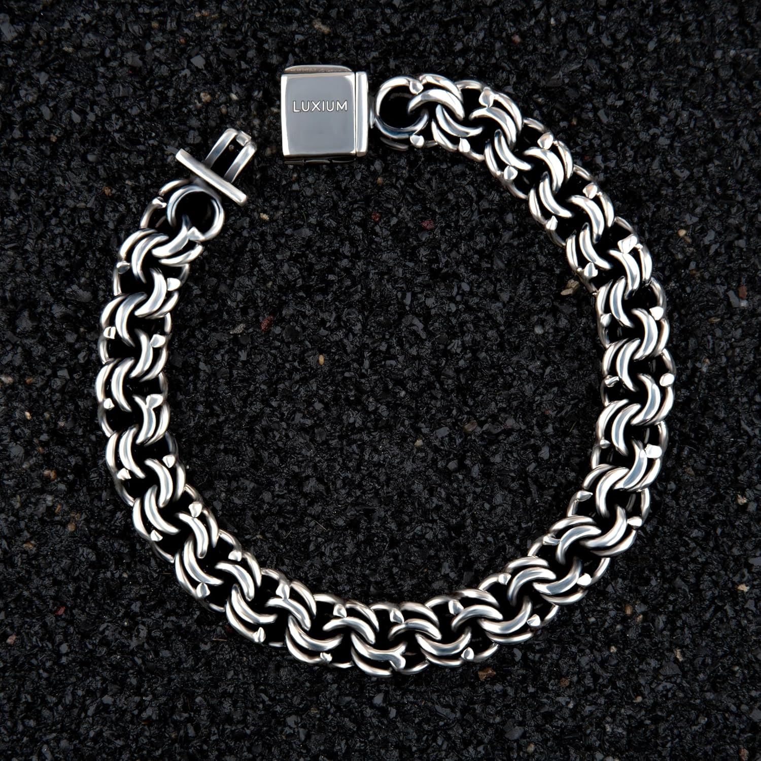 LUXIUM Bismark Bracelet: Sterling silver woven into an intricate double loop, uniting polished brilliance with oxidized depth—refined, dimensional, and boldly elegant.