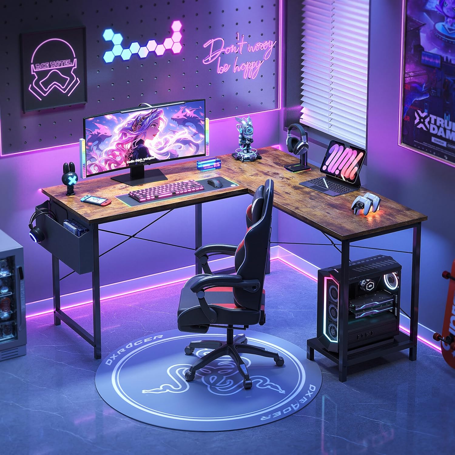 VERMESS L Shaped Desk in a gaming setup with multiple monitors and accessories.