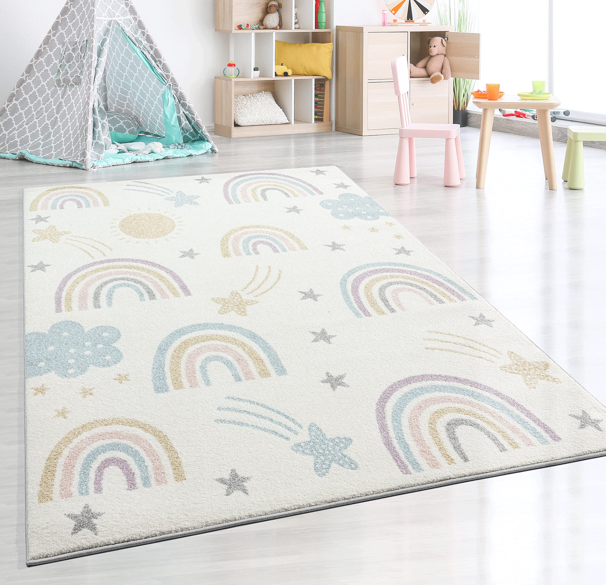 the carpet Dreamy Kids - Alfombra Infantil Moderna, Pelo Suave, fácil de cuidar, no destiñe, Estampado Arco Iris, Crema, 120 x 170 cm