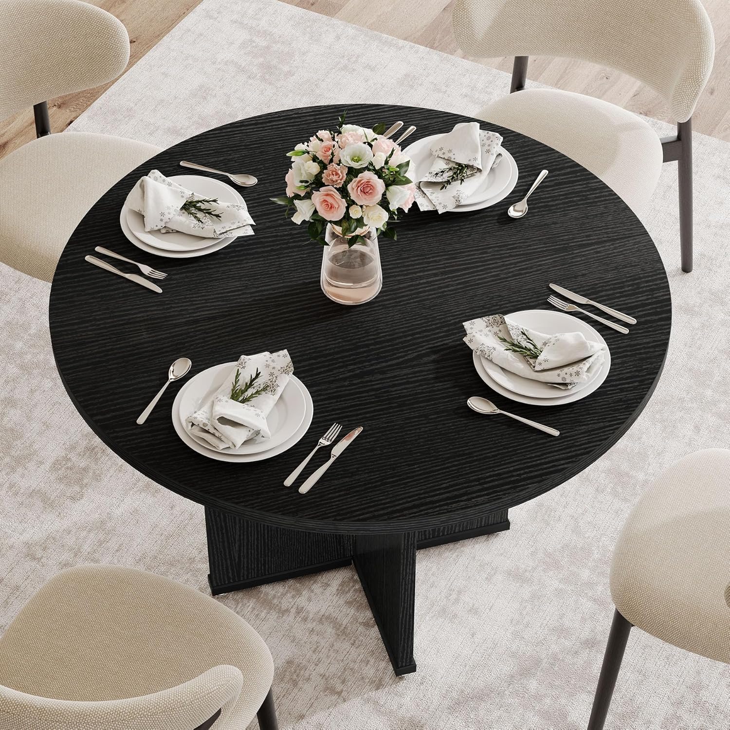 Per sobre view of the Tribesigns Round Dining Table with four place settings and a floral centerpiece.