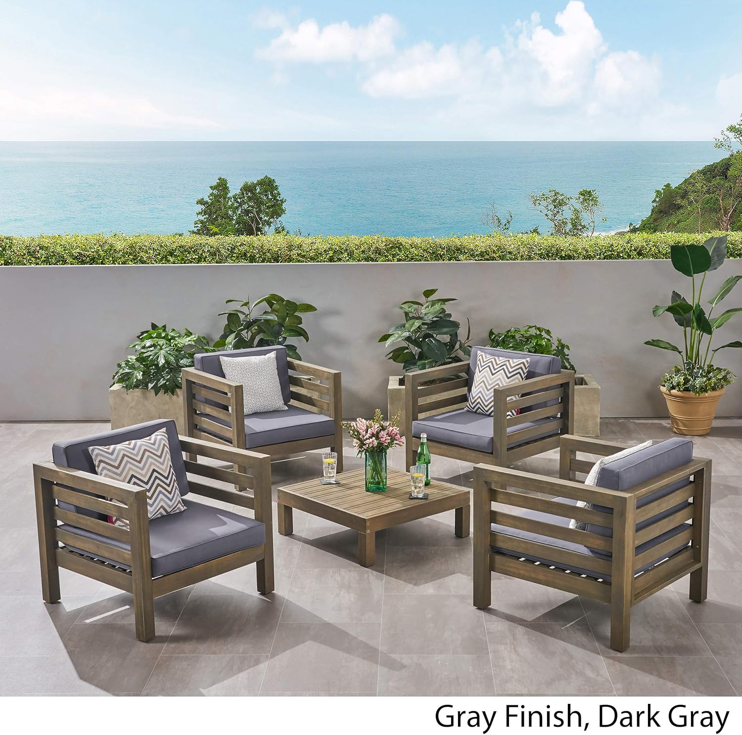 Close-up of the dark gray water-resistant cushion fabric and acacia wood frame