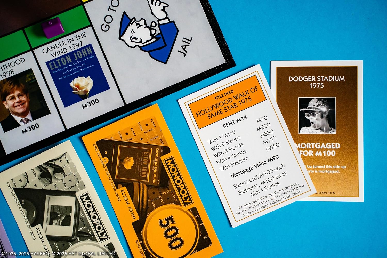 Monopoly: Elton John, Play as Iconic Headgear, Star Glasses & More, Collect Legendary Career Moments Like Knighthood & Farewell Tour, Officially Licensed Elton John Board Game
