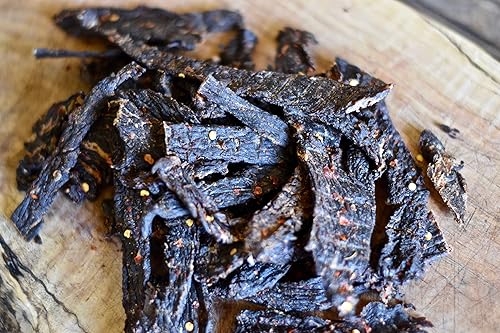 Miniatura 4 de No Man's Land Hot Beef Jerky High Protein Low Calorie Low Carb Carb Snack - Bolsa de 7.0 onzas