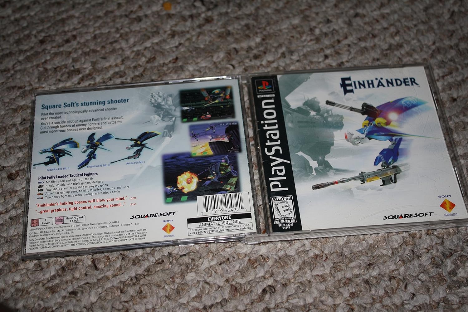 Back cover of Einhander PlayStation game case showing gameplay screenshots and game features