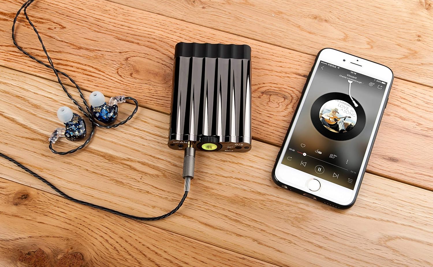 iFi xCAN connected to a smartphone and in-ear monitors