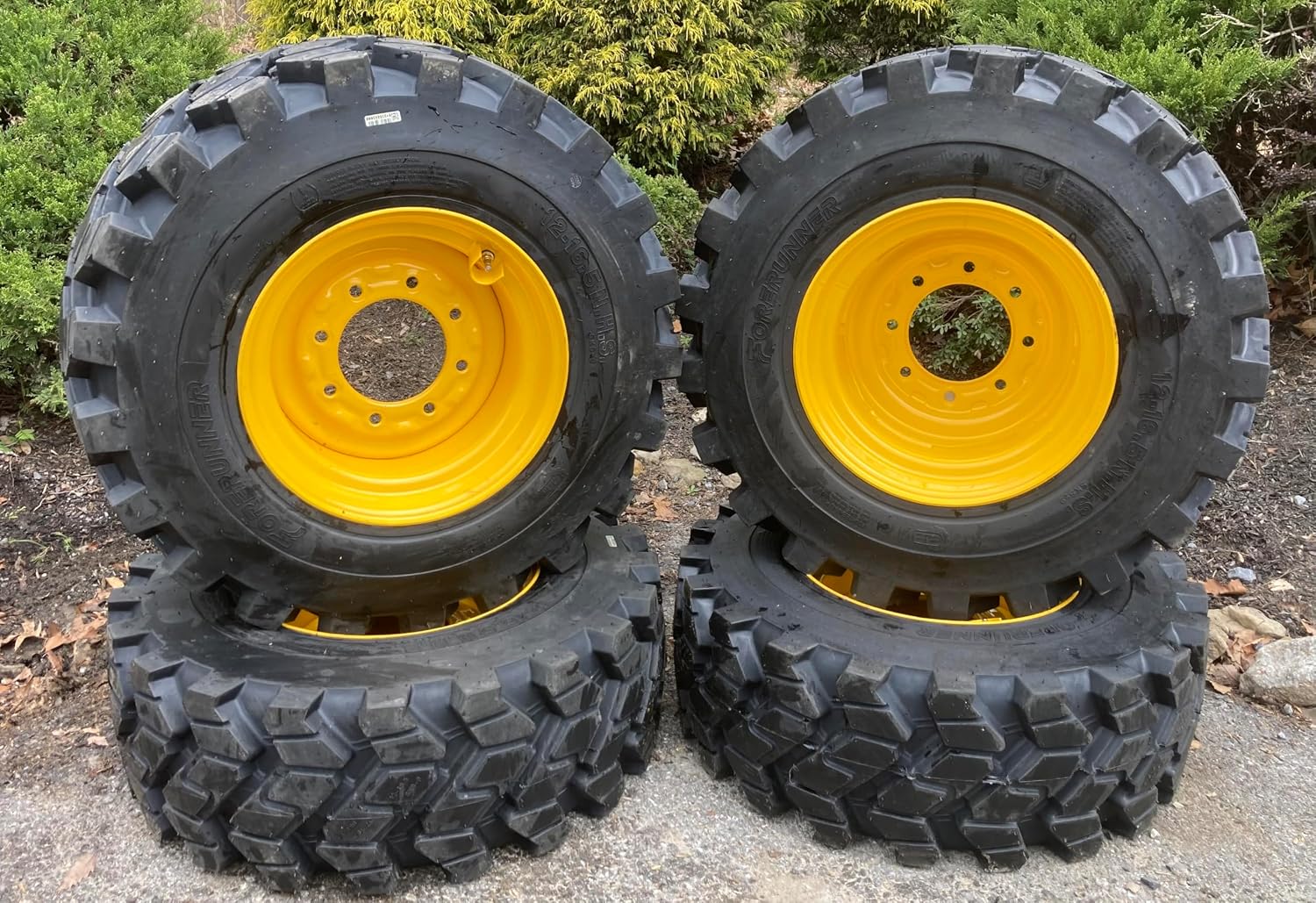 Set of 4-Heavy Duty FOM FILLED (NO FLAT)12-16.5 Forerunner SKS-9 Skid Steer Tires on Wheels/Rims (8 lug) for New Holland L785,LX865,LX885 & more - 12X16.5-14 PLY - Good Snow Traction