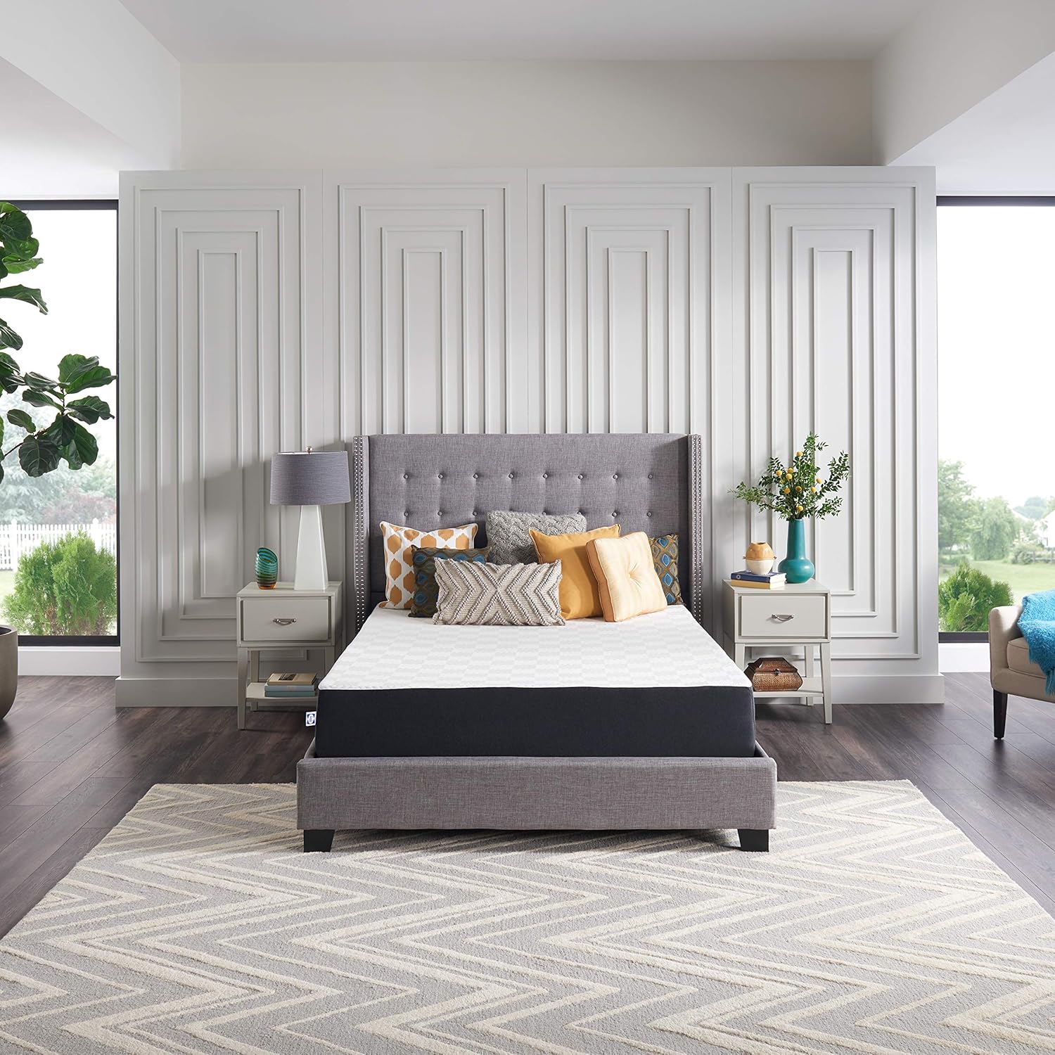 Woman opening a Sealy mattress box in a bedroom