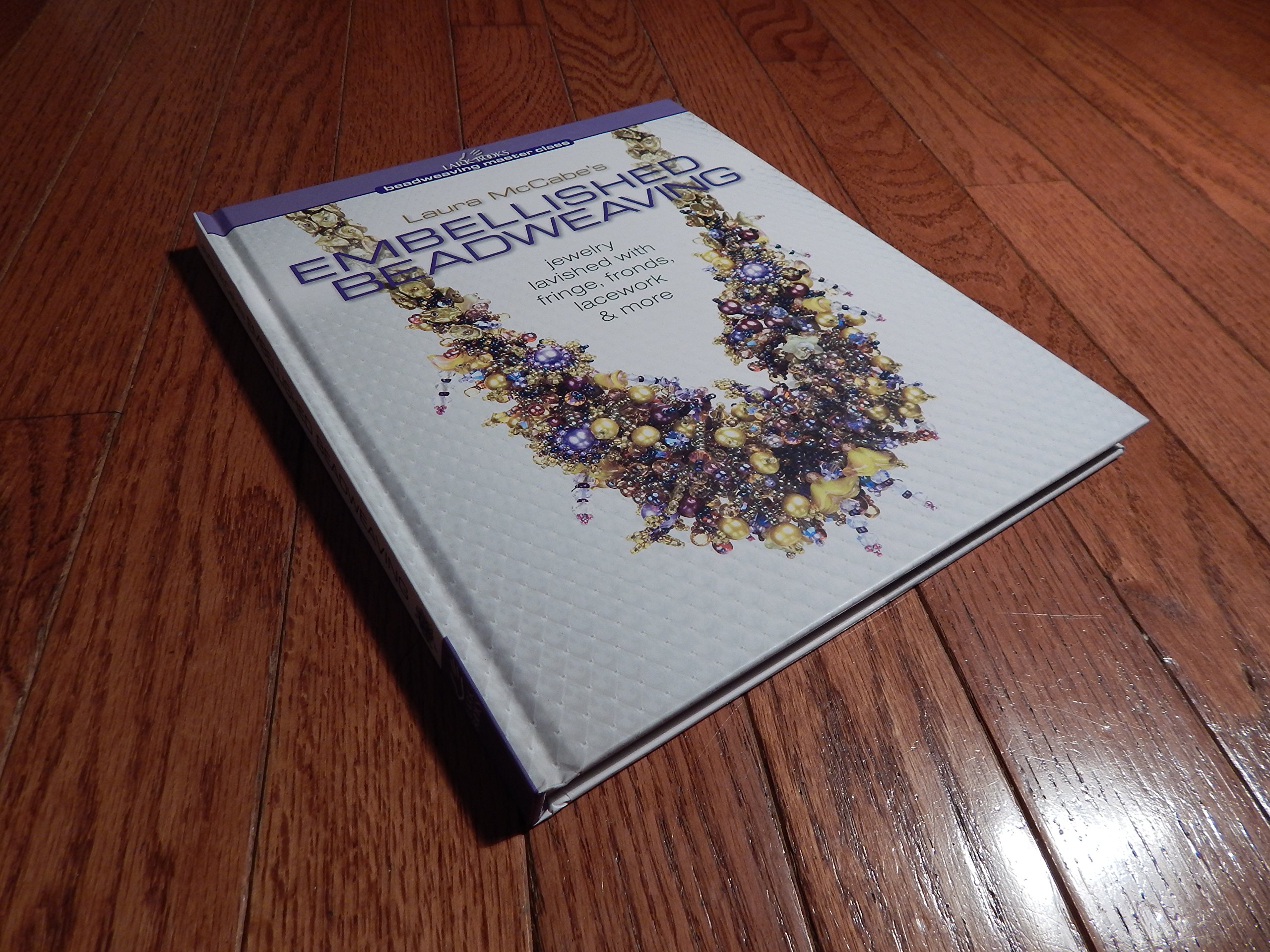Laura McCabe's Embellished Beadweaving: Jewelry Lavished with Fringe, Fronds, Lacework & More (Beadweaving Master Class Series) Hardcover – May 4, 2010