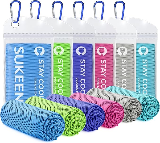 image is of six towels rolled up in the foreground and six towels in clear bags in the background. the towels are blue, lime green, purple, pink, grey, and aqua colored, each one a different color.