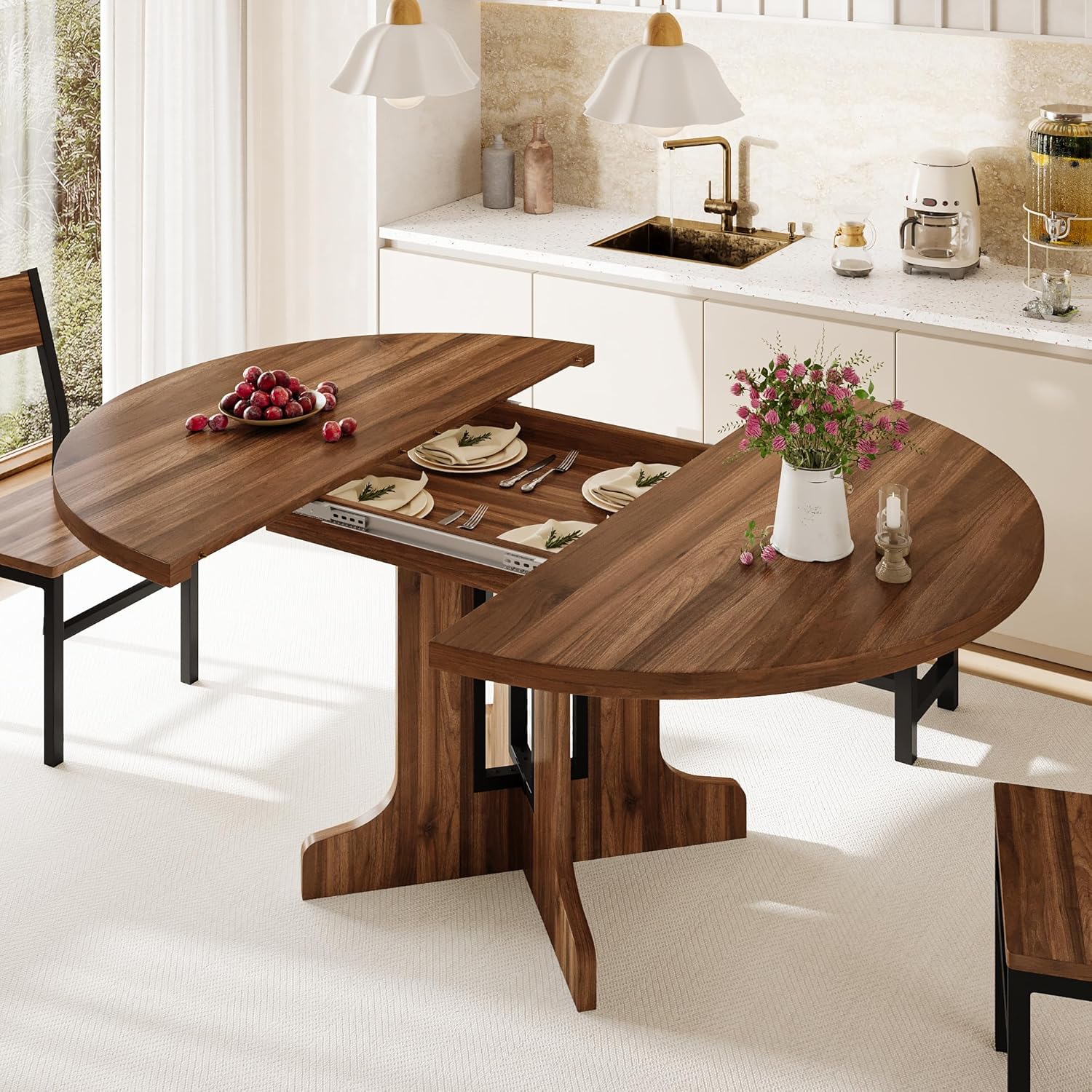 The dining table with the extension panel removed, revealing the internal storage space for the panel.