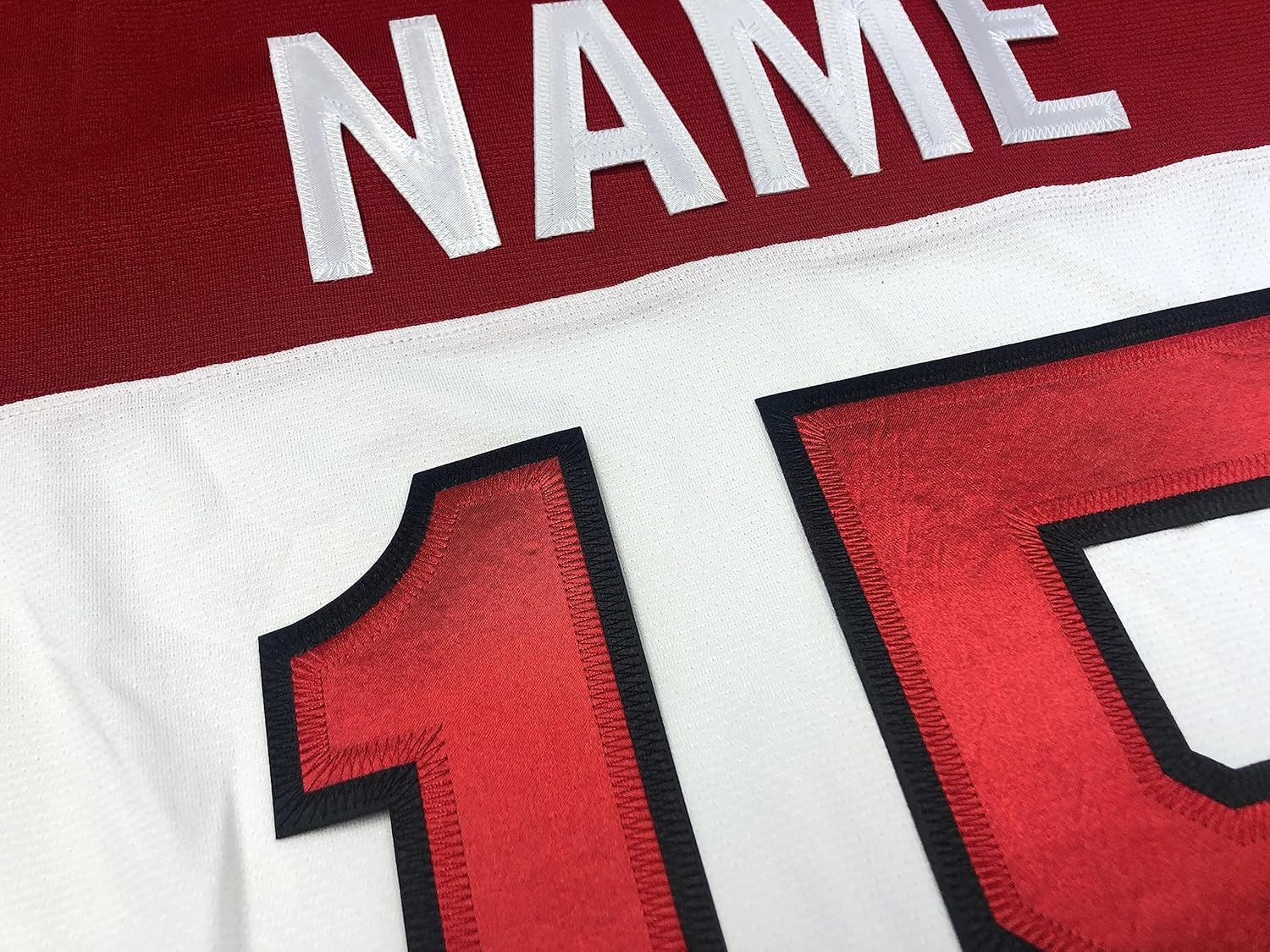 Red and White Hockey Jerseys with a Roadrunners Embroidered Twill Crest