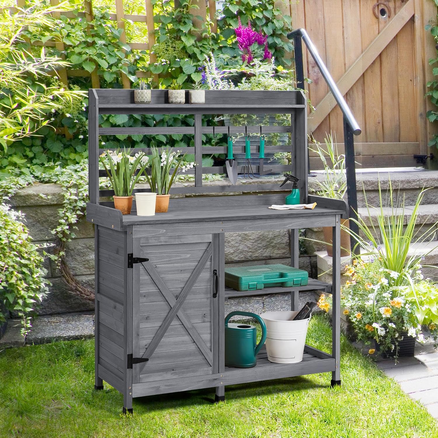 Yaheetech Potting Bench in a garden setting, showing its use for potting plants