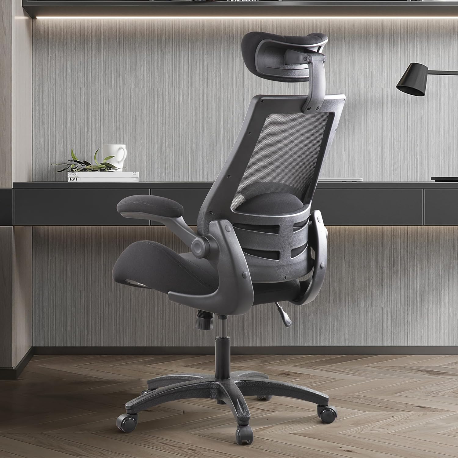 Close-up view of the adjustable headrest on the BOLISS office chair, showing its range of motion.