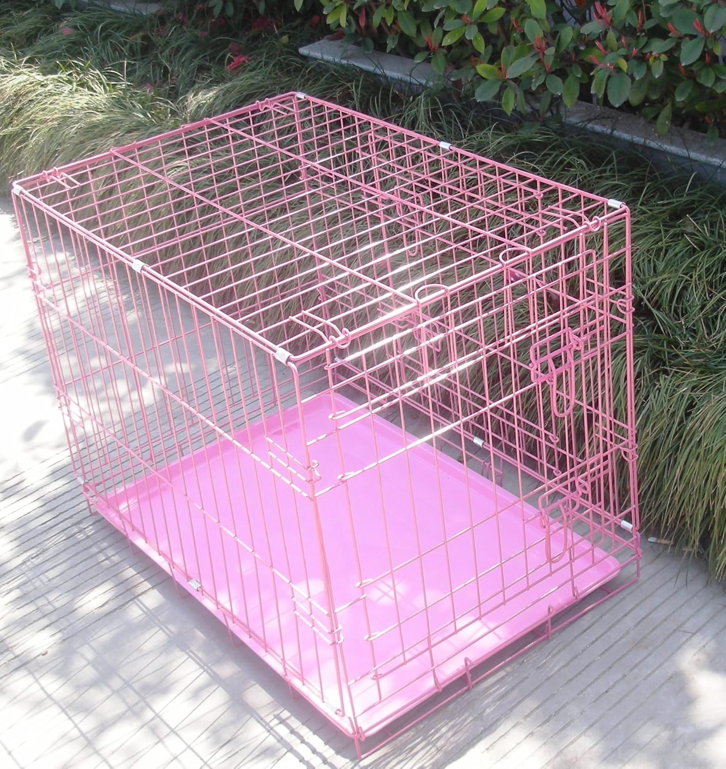 large pink dog cage
