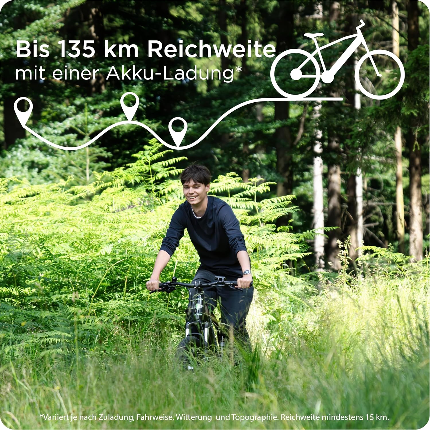 Person riding Zündapp Z898 electric mountain bike on a forest path, with an overlay showing up to 135 km range.