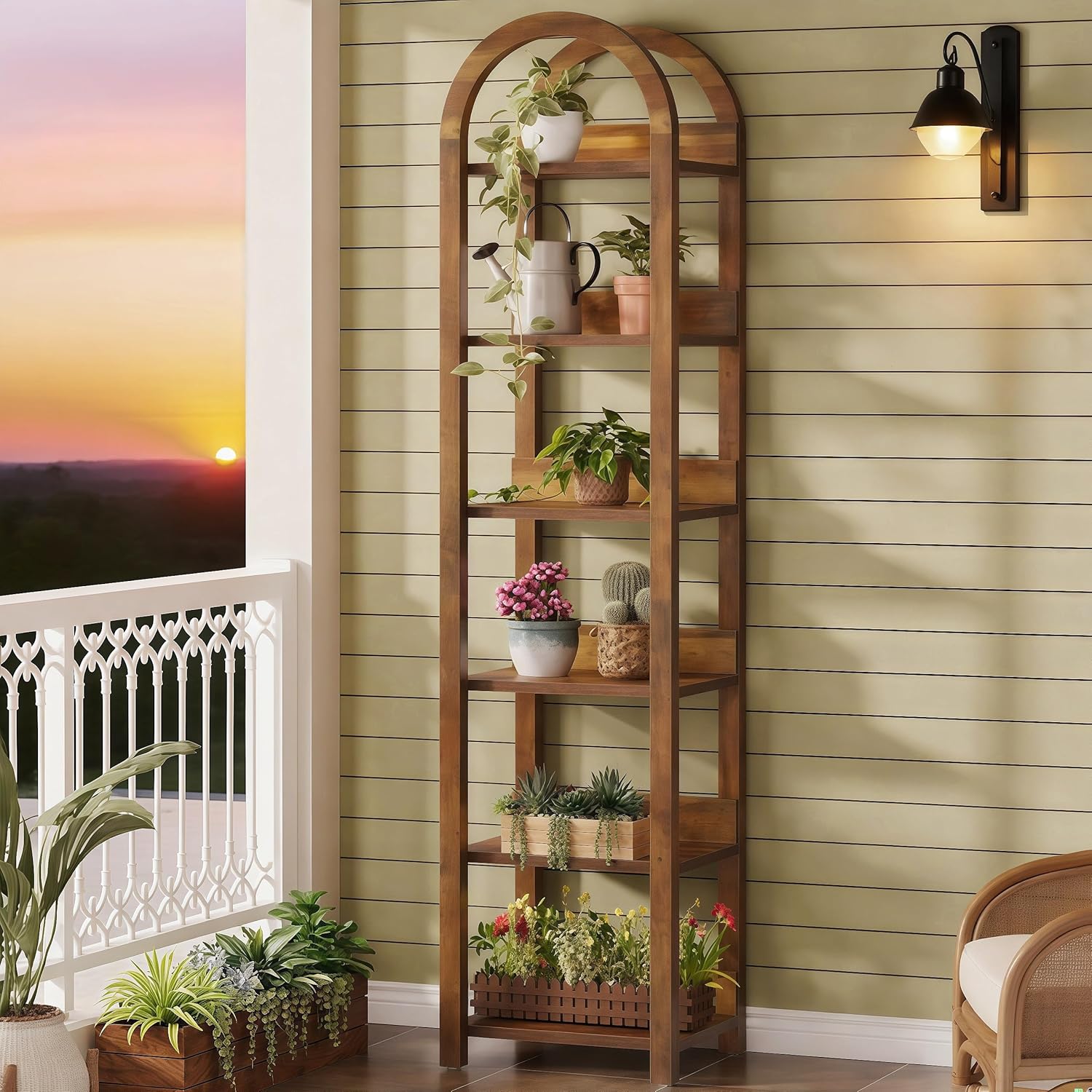 A single Tribesigns 6-Tier Narrow Bookshelf on an outdoor balcony, used as a plant stand with various potted plants.