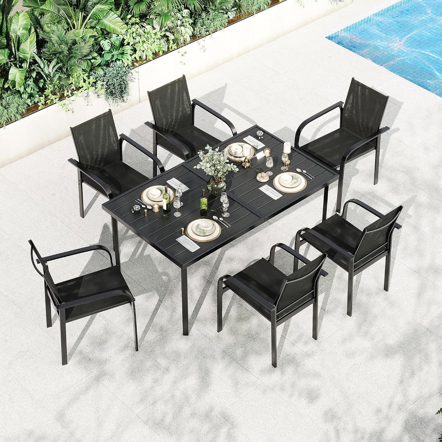 Aerial view of Garvee 7 Piece Patio Dining Set with place settings by a pool