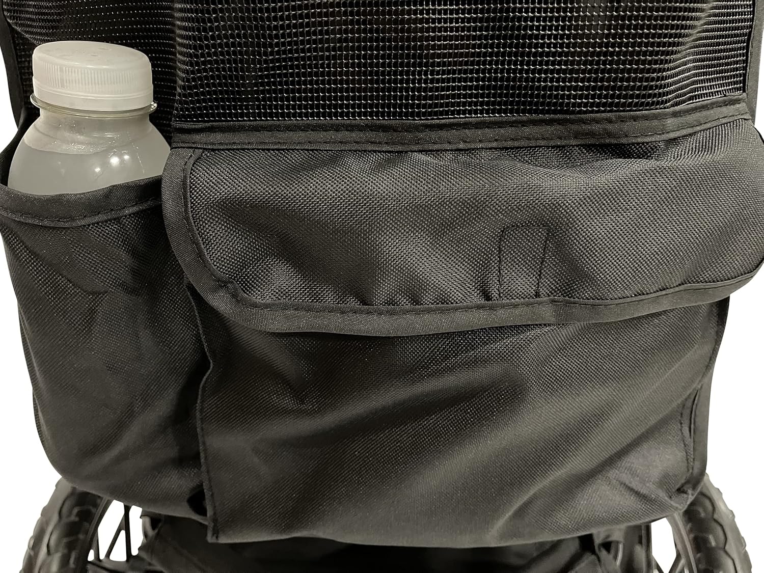 Close-up of a side pocket on the PETIQUE Chinook dog stroller, with a water bottle placed inside.