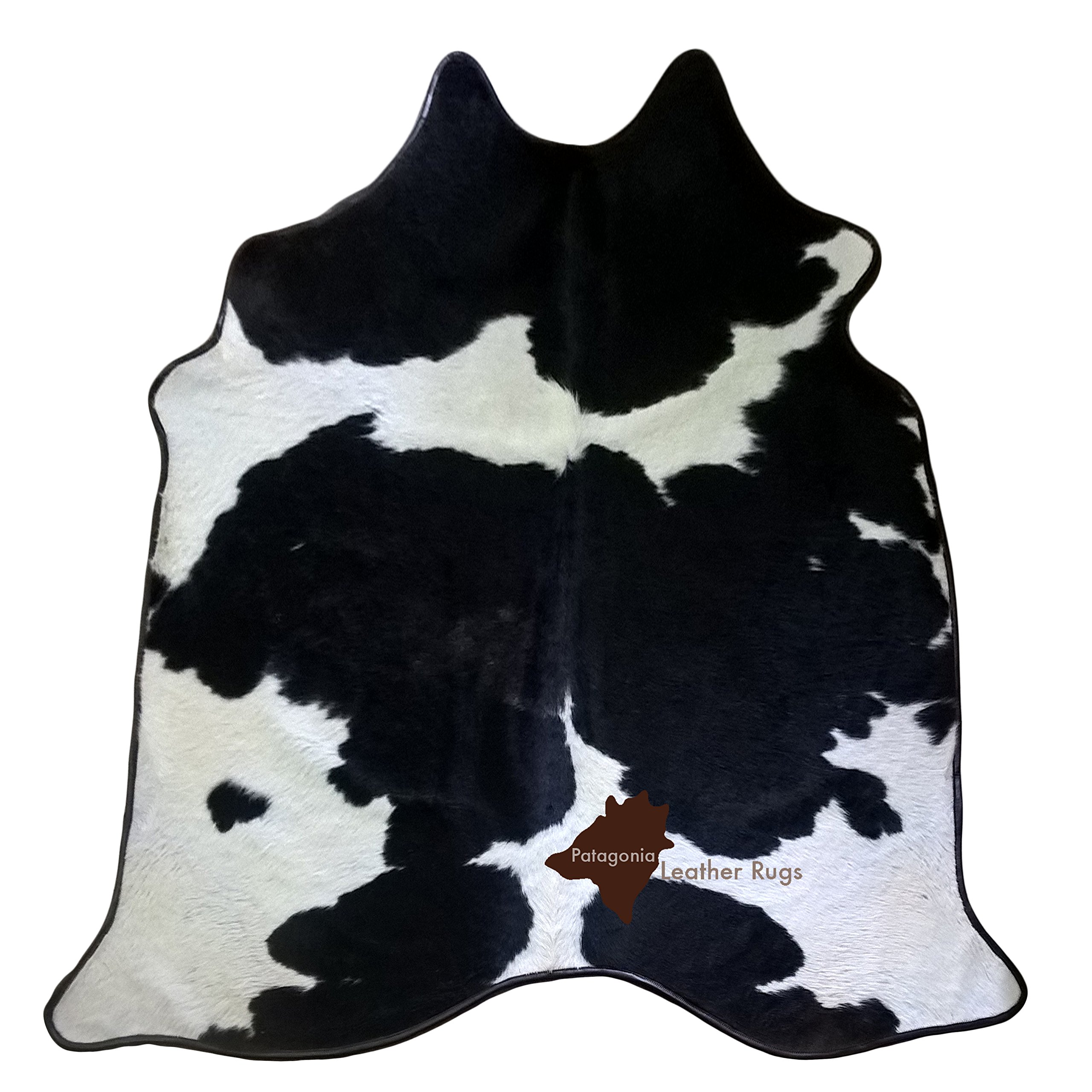 Tapis en peau de vache Black/White anti-corne avec son bord en cuir